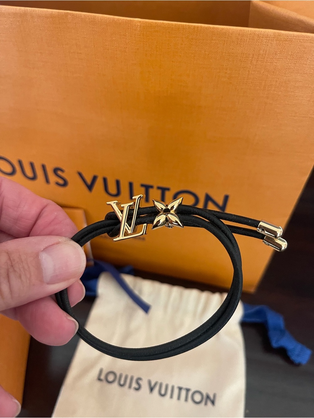 Louis Vuitton Blossom Black Cord Bracelet with Gold LV and Flower. Adjustable.